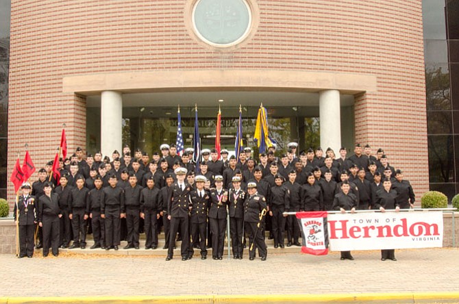 Maxwell (front center) celebrates with Herndon Navy JROTC cadets after the October 2015 Herndon Homecoming Parade.
