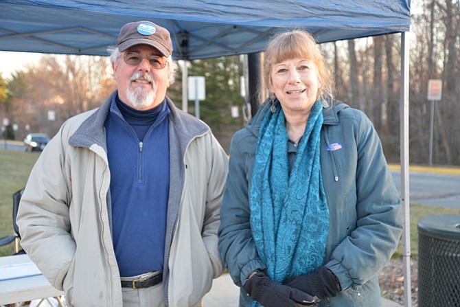 Democratic Precinct Capt. Richard Chew and voter Nancy Olds braved the early morning chill on Super Tuesday at the South Lakes High School polling place in Reston. “This is a heavily Democratic precinct,” said Chew, “but I think there has been a higher percentage of Republican turnout this year. People are really engaged.”
