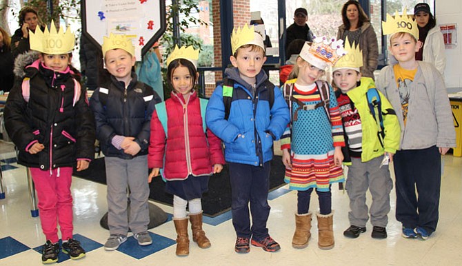 Churchill Road kindergarteners Ruhi Rana, Ean Munn, Adeline Middleton, Davi Madsen-Kleiman, Emma Kry, Lucas Muangman and Pierce Wiltbank proudly model the “100 days smarter” crowns that they made on the 100th day of school.
