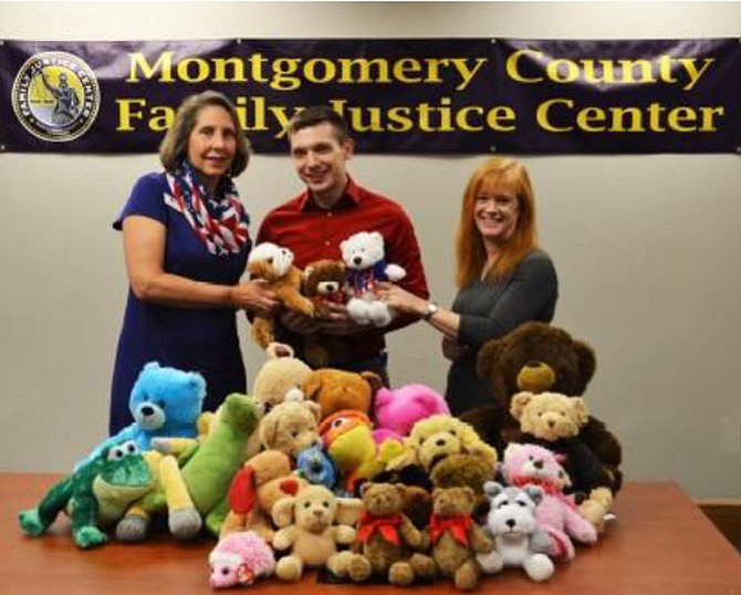 In January, delivering stuffed animals to the Montgomery County Family Justice Center are (from left) Jackie Cronin, Acting FJC Director Thomas Manion, and Patty Vitale.
