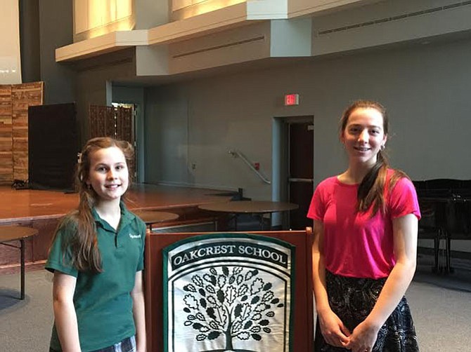 Maria Luisa Bertolini, left, and Angela Diaz-Bonilla receive $5,000 scholarship as recipients of the Oakcrest School’s Veritas Awards.
