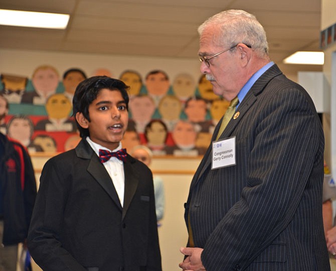 Aaron Joy, a fifth-grader at the Nysmith School, explains his science fair project on bio-plastics to U.S. Congressman Gerry Connolly (D-11), who was also an event speaker. During his remarks, Connolly praised Fairfax County in particular for its investment in education, but cautioned that “other countries have caught up to us, we need to continue and advance our investment in STEM, in research and development and in improving our infrastructure.”
