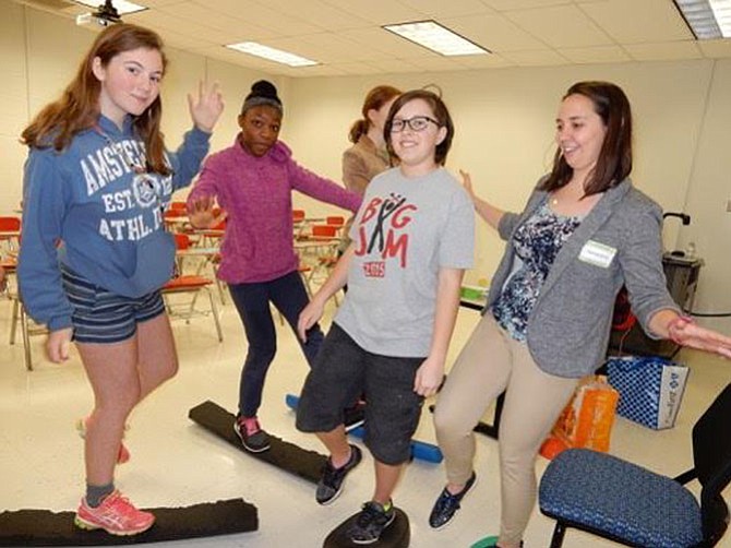 Student workshop presenter Kassidy Hook, far right, a physical therapist at Physiotherapy Associates in McLean, engaged the girls in activities, as well as described a career based on one of the STEM fields. Each girl attended three 40-minute workshops.
