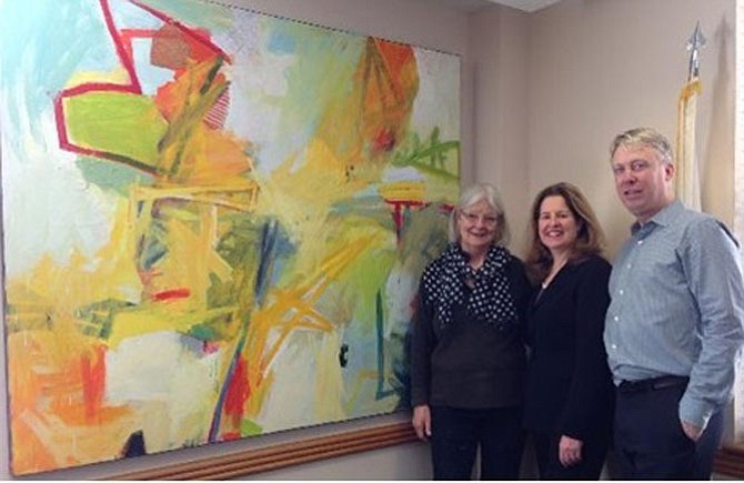 Potomac artist Tory Cowles, left, is one of three artists selected to have her work displayed in the office of City of Alexandria (Va.) Mayor Allison Silberberg. Cowles is shown with Silberberg and Torpedo Factory Arts Center CEO Eric Wallner next to her painting #875, which will be on exhibit through early 2017.
