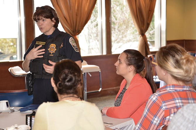 Herndon Police Chief Maggie DeBoard talks with residents at the “Coffee with a Cop” event. DeBoard was appointed to a Steering Committee to help clear up a backlog of untested forensic kits from victims of sexual assault throughout the Commonwealth. 
