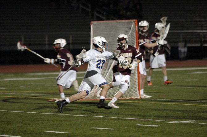 Robinson senior Johnny Daniel, seen during the Rams’ season opener against Broad Run, scored five goals against Yorktown on March 19.