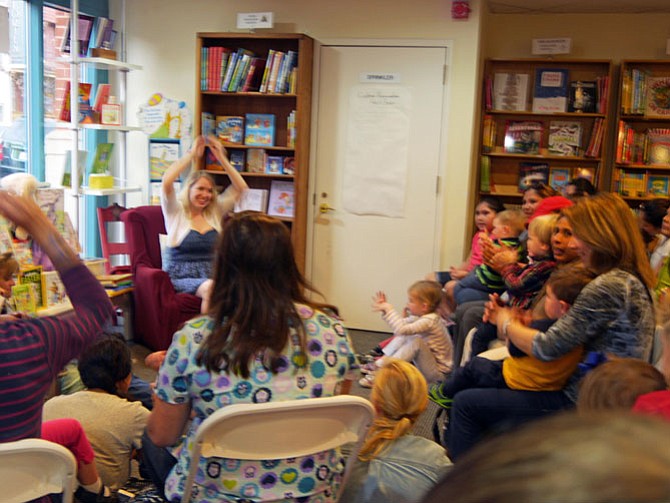 Emily Henry reads Friday morning story hour for children under two-years old. She says you have to go as fast as you can to keep their attention.
