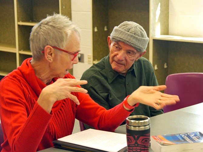 Diane Ullius, team leader for the week for the German conversation at Langley-Brown Community and Senior Center, discusses the impact of learning something new with Carlos Hecker.
