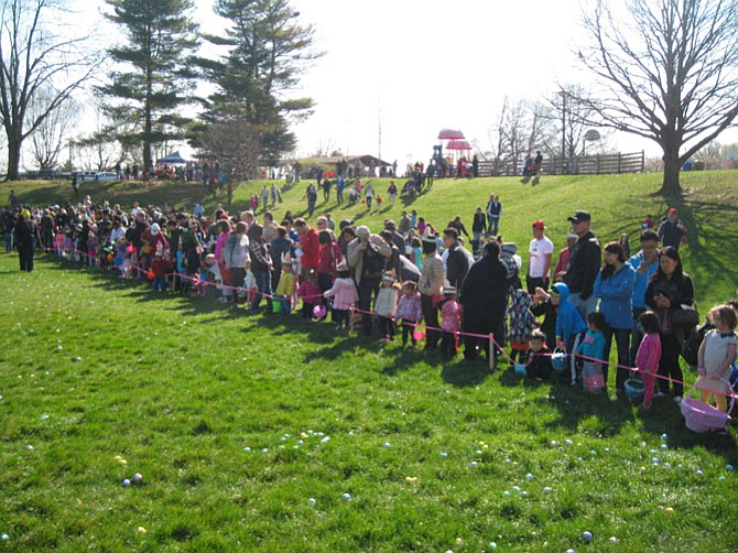 Spectators line up at Van Dyke Park in the City of Fairfax for the Easter Egg Hunt to begin.
