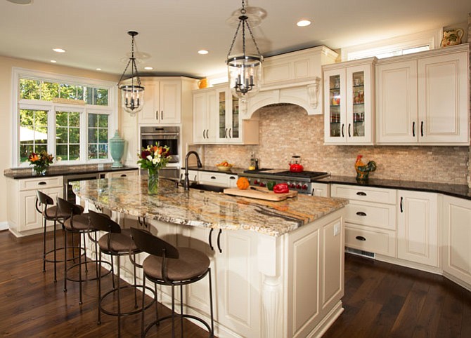 The island is positioned for easy service to the new breakfast table , but also works as a dining counter. The base itself is equipped with an antique copper farm sink, a microwave and a dishwasher. 