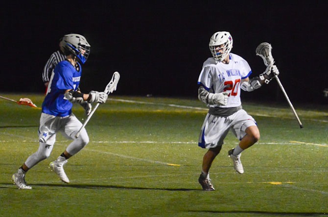 Sam Zang (20) and the T.C. Williams boys’ lacrosse team defeated West Potomac on Tuesday night.
