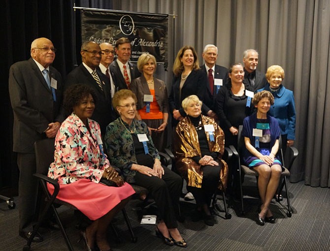 The 2016 Living Legends of Alexandria gather with city officials for a group photo at the March 15 Meet the Legends reception at the U.S. Patent and Trademark Office. Seated are Ruth Cleveland, Wanda Dowell, Betsy Anderson and Diane Charles. In back are Herman Boone, Bill Cleveland, Warden Foley, U.S. Rep. Don Beyer (D-8), Janet Barnett, Mayor Allison Silberberg, Ulysses James, Jodie Smolik, Steve Nearman and council woman Del Pepper. Missing are Bill McNamara, Lorraine Friedman and Kim Allen Kluge.
