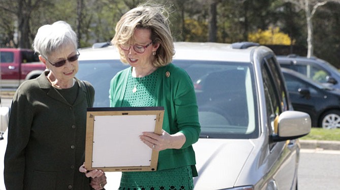 Marilyn Bidgood accepted a Congressional Record honoring her late husband, Colonel Fred Bidgood, from U.S. Rep. Barbara Comstock (R-10) at Huntsman Square Starbucks in Springfield.
