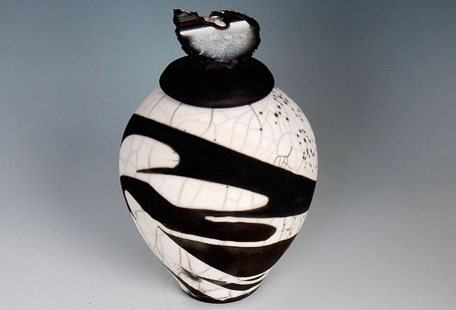 Pictured here: "Peace," Bev Andrews. The Associates Gallery will feature two member artists in a complementary scheme of black and white rendered in two-dimensional and three-dimensional work. Bev Andrews is a ceramic artist known for black and white raku vessels. The black color results from carbon produced in the firing process and the white is the natural color of the fired clay. Jo Ann Tooley is a fine art photographer who specializes in the black and white film. Work for this show includes prints made from old 35mm negatives depicting early morning scenes from rural  West Virginia, clouded by fog. “It’s Black and White” will be on display March 29-April 24. Visit www.torpedofactory.org for more.
