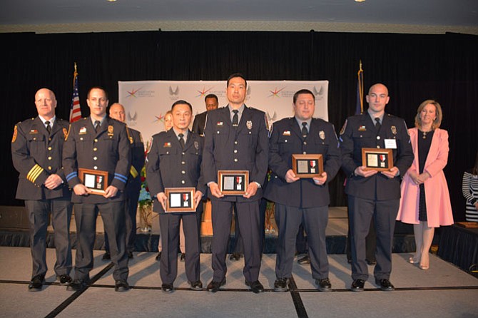 From left, Chief of Fairfax County Police Edwin Roessler Jr. presents Second Lieutenant Nicholas Depippa, Police Officer First Class Federick R. Yap, Police Officer First Class Peter T. Liu, Police Officer First Class Paul J. Blasko Jr. and Officer Jesse B. Katzman with the Silver Medal of Valor for responding to a shooting in the middle of the night and saving the victim’s life.
