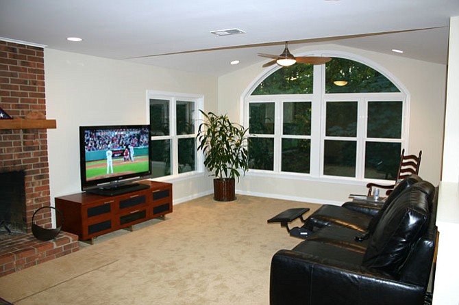 Only 150 square feet was added to the family room, but the four-window course with “eyebrows” creates a visual continuum that makes the room feel significantly larger.
