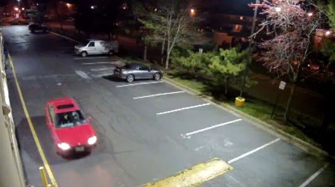 Police believe the suspect in the March 30 robbery and sexual assault was driving a red car with a distinct non-red patch on the driver’s side.