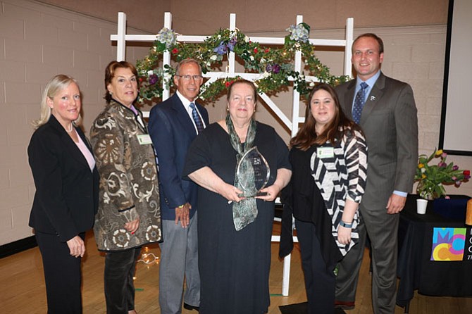 2015 H. Gordon Randall Outstanding Volunteer Mary Anne Hampton (center) with MCC Special Events Manager Catherine Nesbitt, MCC Board Member Deborah Sanders, MCC Executive Director George Sachs, MCC Board Member Laurelie Wallace and MCC Board Chair Paul Kohlenberger.