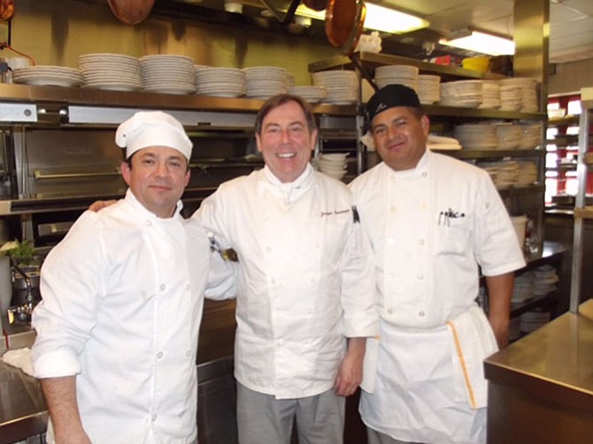 From left -- Sous chefs Freddie Ventura and Antonio Rivera in the kitchen with chef Jacques Haeringer.

