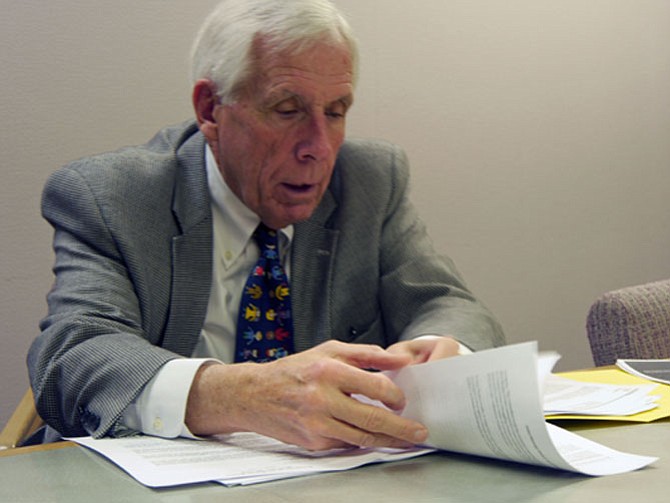 Frank Wolf, former U.S. representative from Northern Virginia, reads from the study he commissioned from the Polaris Project in 2011. It identified 21 cities in Northern Virginia with 82 Asian massage parlors suspected of sex trafficking.
