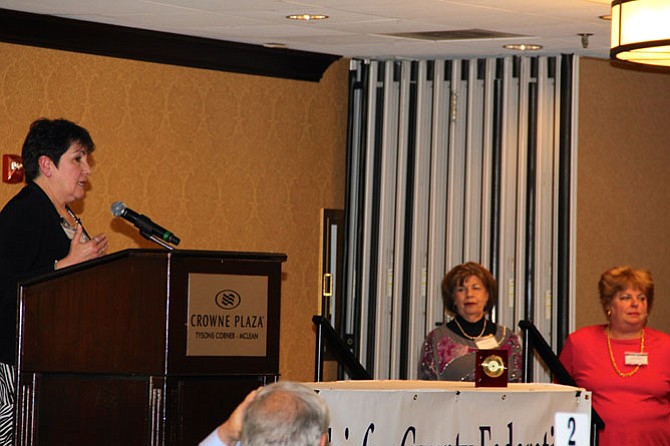 Olga Hernandez acknowledges her designation as Citizen of the Year as Sherry Zachry and Dianne Blais, LWV-FA co-president, look on. 