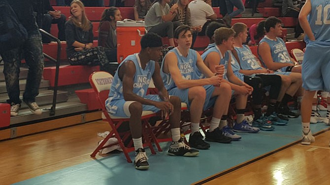 Westfield’s Blake Francis, left, and Centreville’s William Unterkofler, second from left, sit on the bench during the Nova Classic on April 10 at Marshall High School.