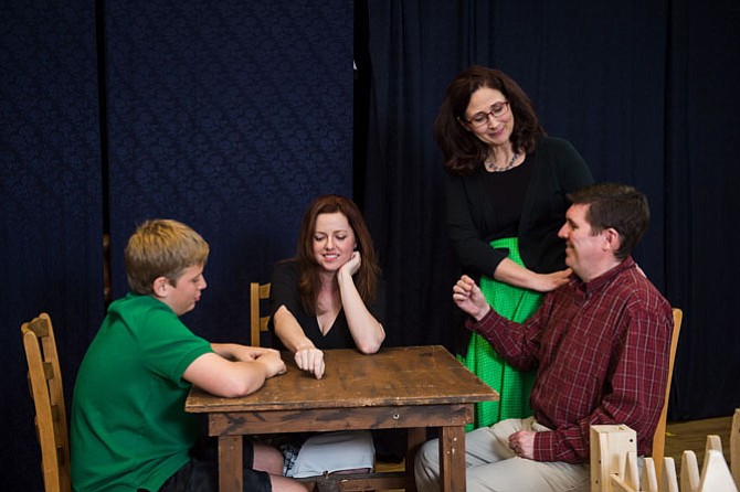 Reston Community Players “Our Town” rehearsal photo: From left -- Alex Parish (as Wally Webb), Lori Brooks (as Emily Webb), Roberta Chaves (as Mrs. Webb), Dennis McCafferty (as Mr. Webb)
