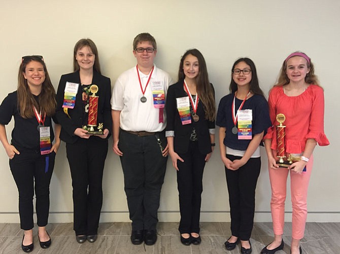 From left, Tina Thayer, Kate Taylor, Paul Nelson, Lucy Brown, Evelyn Nguyen, and Izzy Rees attend a leadership conference as part of Herndon Middle School’s chapter of FCCLA.
