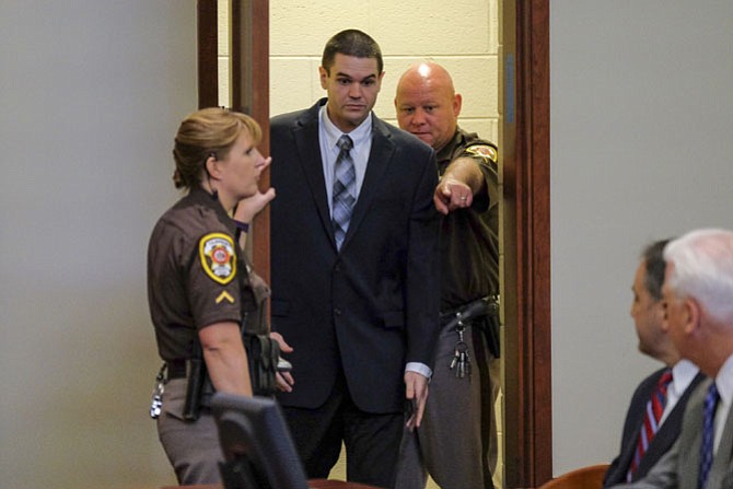 FAIRFAX, VA  Ð APRIL 18:.Fairfax police officer Adam Torres enters the courtroom before pleading guilty in the shooting death of citizen John B. Geer at Fairfax Circuit Court with Judge Robert J. Smith in Courtroom 5J on Monday, April 18, 2016, in Fairfax, VA.  Torres shot Geer as Geer was standing, unarmed with his hands up, in the doorway of his home..(Photo by Jahi Chikwendiu/The Washington Post)