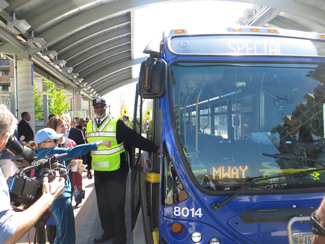 Transitway bus, driven by Akil Nuriddin, takes on its first passengers.
