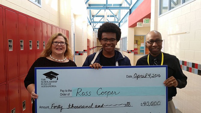 T.C. Williams senior Ross Cooper, center,  is presented a $40,000 scholarship April 6 from the Scholarship Fund of Alexandria executive director Beth Lovain, left, and T.C. Williams principal Dr. Jesse Dingle. It is the largest single SFA award for 2016.
