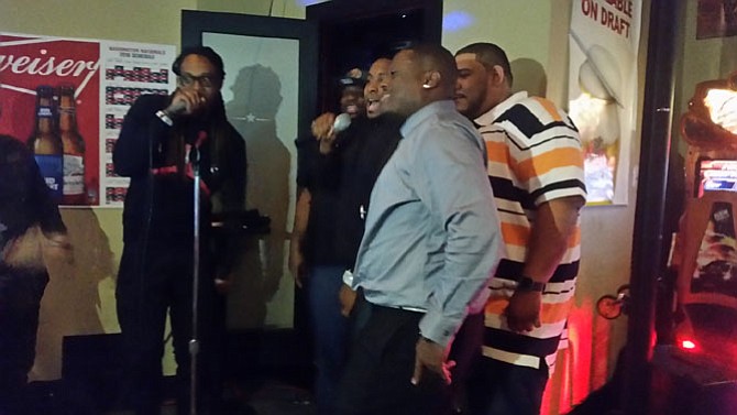 Local men sing Karaoke in support of Lisa Gray’s fundraising effort.