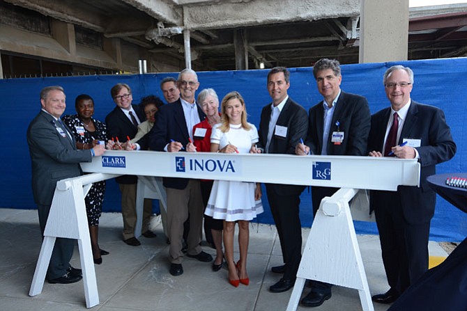 Guests and donors joined hospital employees and leaders on April 19 to sign the last steel beam to be added to the new Inova Mount Vernon Hospital Veatch Family Emergency Department.
