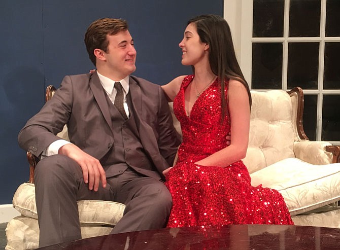 The characters portrayed by Jack David and Caroline Barnes share a tender moment in the play.
