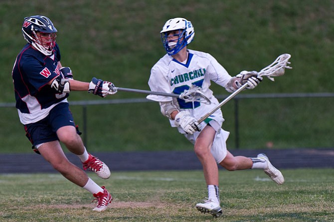 Churchill sophomore Brady Altobello, right, scored three goals against Wootton on April 21.