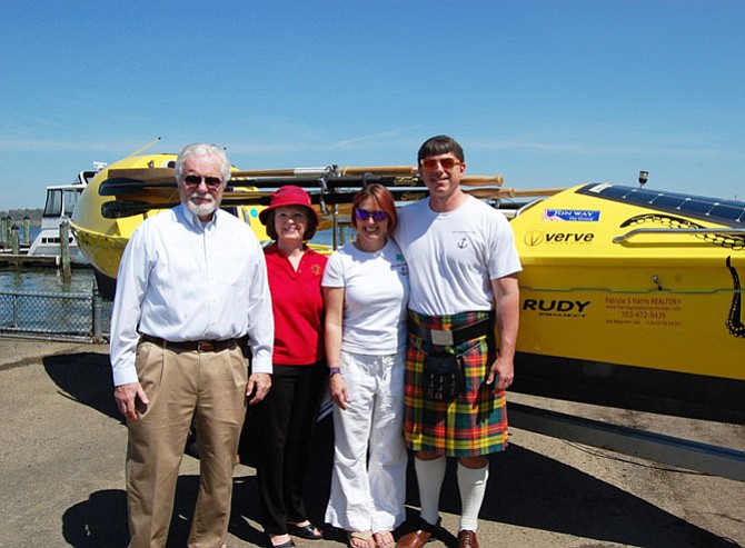 Alexandria residents Cindy Way and James Caple, at right, are joined by Old Dominion Boat Club president Richard Banchoff and past president Carolyn Bell following the April 16 ODBC christening ceremony of a specially designed boat that the couple plans to row across the Atlantic Ocean.

