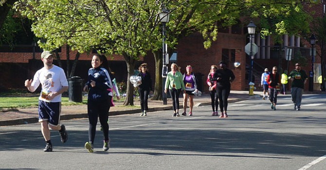 Participants in the GW Parkway Classic make their way along Union Street April 24 as they near the finish line at Oronoco Bay Park.
