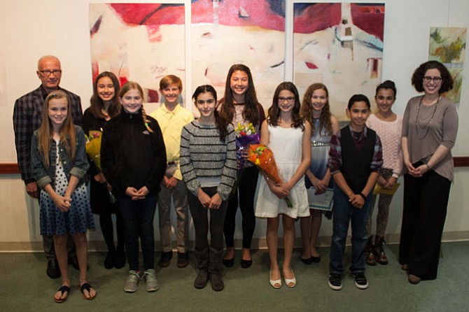 Author Henry Cole, left, and Friends of the Great Falls Library President Michelle Miller, right, flank the ten finalists of the Great Falls Writers Group Creative Writing Contest.  Finalists are, from left to right, Erin Kearns, Katherine Stockton, Julia Toloczko, Riley Luce, Miky Kassem, Julia Fremberg, Cecelia O'Sullivan, Elisabeth Anderson, Luke Tibbs, and Karma Kassem. 
