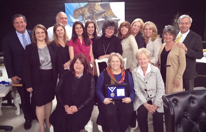 From left are Rick Hoffman, regional vice president; Rachel Carter, branch vice president; Tracy Vitali; Tom Rickert (back row); Kathy Kratovil; Ann Marie Grotticelli; Karen Leonard; Lyssa Seward; Beth Mazzanti; Cathy D’Antuono; Susie Carpenter; Ellis Duncan; (front row) Liz Bucuvalas; Bonnie Rivkin; and Donnan J. Wintermute.
