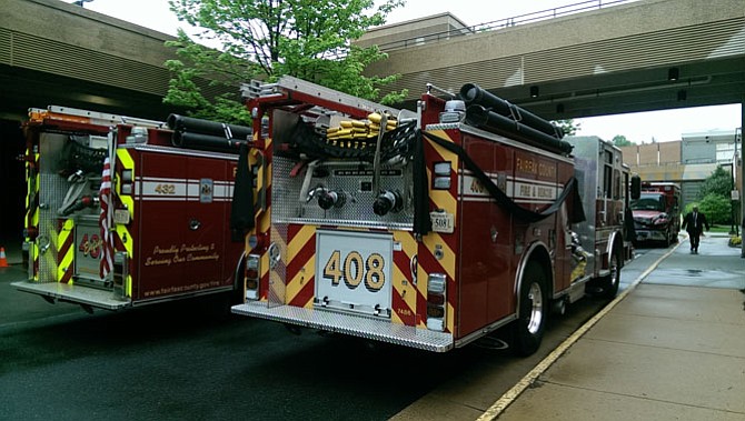 Fire engines parked outside the McLean Bible Church pay tribute to firefighter-paramedic Nicole Mittendorff, 31, who Virginia State Police believe died of suicide in Shenandoah National Park.
