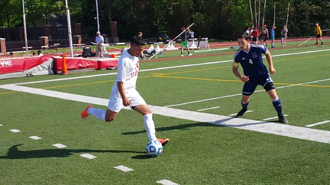 Woodson’s Sean Garin, right, defends against T.C. Williams’ Kevin Nunez.