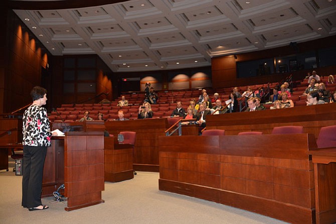 Fairfax County Board of Supervisors Chairman Sharon Bulova (left) addresses the individuals gathered at the May 3 Heroin and Prescription Drug Abuse Town Hall meeting.