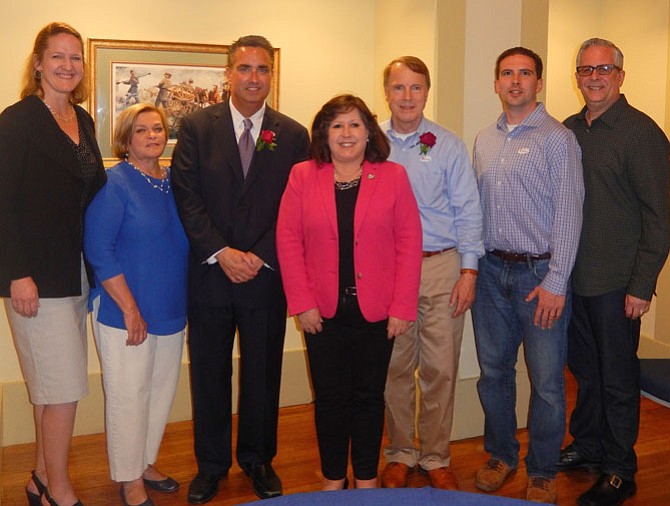 Mayor Scott Silverthorne (in suit) with City Council members (from left) Nancy Loftus, Janice Miller, Ellie Schmidt, David Meyer, Jon Stehle and Michael DeMarco.
