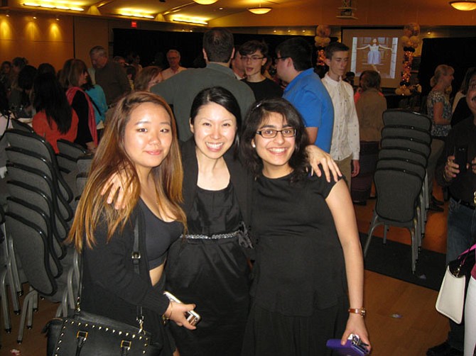 Fashion Design 1 students Jade Park and Kriti Bhagat with instructor Jin-A Chang (center) after the show. 
