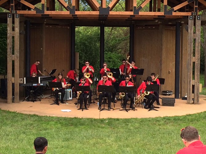 The sky was darkening and wind blowing up when the James Madison High School Jazz Band took to the stage, playing with smooth finesse.
