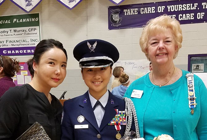 Cadet Major Alicia Cho (center) with her mother, Joy Chong (left), and Providence Regent Janet Crowl (right).
