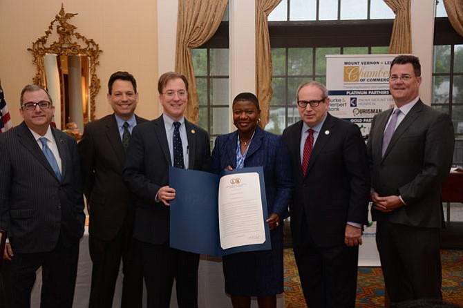 Inova Mount Vernon Hospital CEO Deborah Addo accepts a special General Assembly resolution recognizing the hospital. From left -- State  Senators  Adam Ebbin (D-30) and Scott Surovell (D-36), Del. Paul Krizek (D-44), Del. Mark Sickles (D-43) and Del. Dave Albo (R-42) at the May 12 Mount Vernon-Lee Chamber of Commerce business breakfast. 