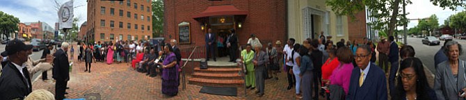 The congregation gathers outside Beulah Baptist Church.
