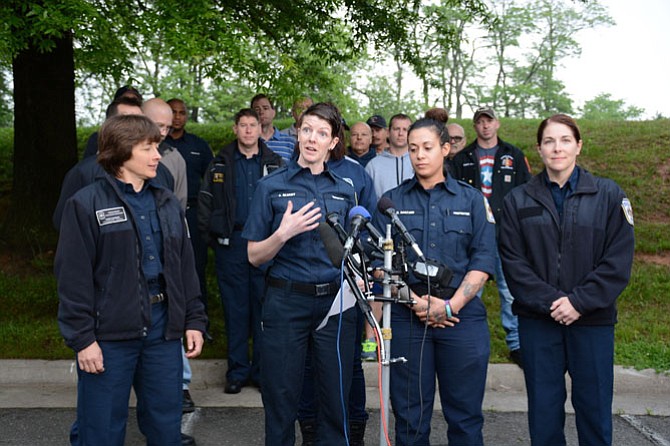 Female firefighters and supporters gathered outside Fairfax County Fire Station 8 in Annandale to assert their positive experiences as women in the department.