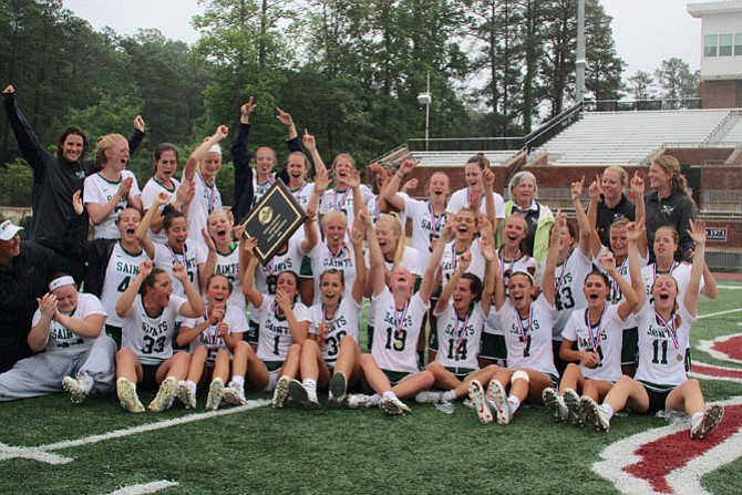 The St. Stephen’s & St. Agnes girls’ lacrosse team celebrates winning the VISAA state championship on Saturday. The Saints defeated Bishop Ireton 12-5.